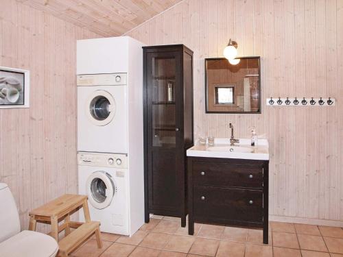 a bathroom with a sink and a washing machine at Two-Bedroom Holiday home in Hemmet 3 in Hemmet