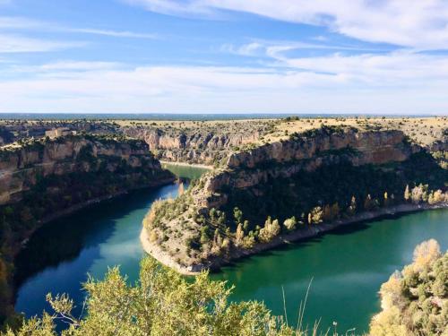 an aerial view of a river in a canyon at El pajar de abajo - Pedraza - in La Alameda