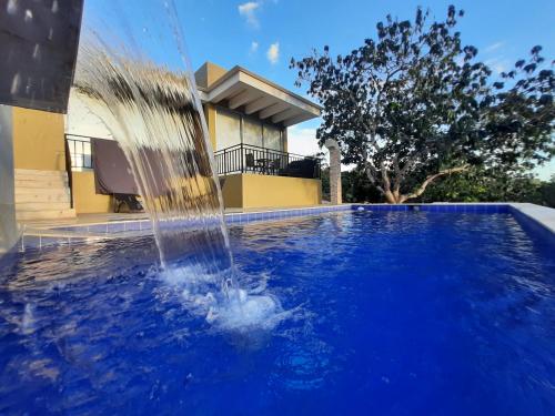 a water fountain in front of a house at Mountain View Anapoima in Anapoima