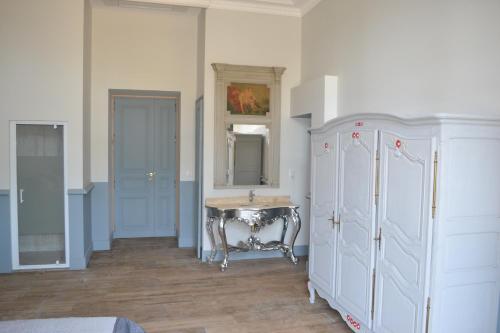 a bathroom with a sink and a mirror at domaine Les Castans in Saint-Thibéry