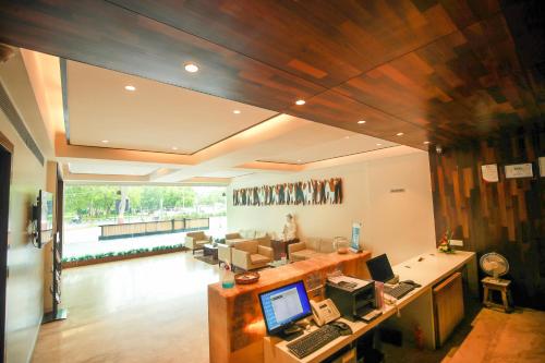 an office with a desk with a computer on it at Hotel German Palace Near to Airport in Gandhinagar