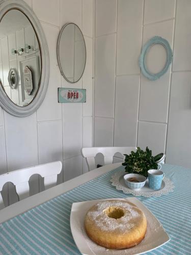 a donut sitting on a plate on a table at Petite house in Starigrad-Paklenica