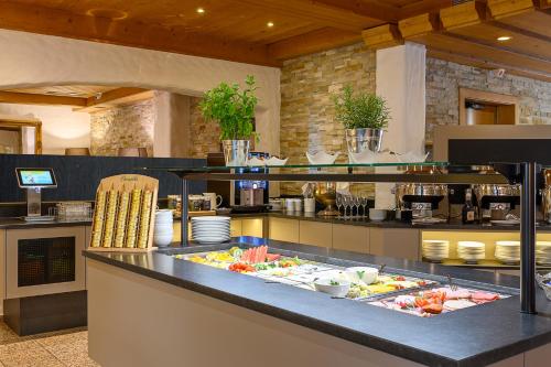 a buffet line with many different types of food at Garni Das SONNALP in Maurach