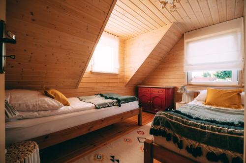 Llit o llits en una habitació de Łap Las Pelnik