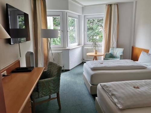 Postel nebo postele na pokoji v ubytování Hotel Schober