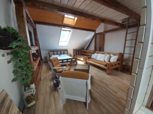 a living room with a couch and a table at Apartmán Sarah Noemi, 100 m SKIBUS JASNA in Liptovský Mikuláš
