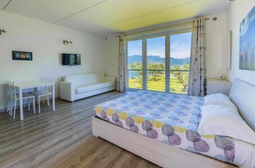 Postel nebo postele na pokoji v ubytování Direttamente Al Lago Apartments