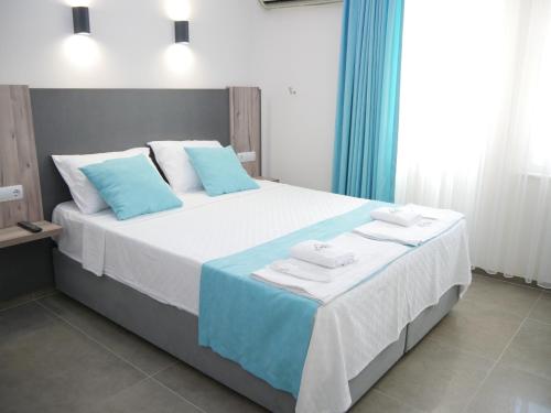 Ένα ή περισσότερα κρεβάτια σε δωμάτιο στο Nefis Hotel Ölüdeniz