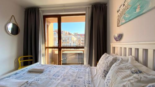 A bed or beds in a room at APARTELLO Modern Apartment - Balkan Breeze 7
