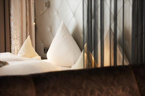 Un ou plusieurs lits dans un hébergement de l'établissement Hotel Brigitte