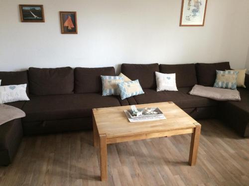 a living room with a couch and a coffee table at Ferienwohnung-Bieberblick in Greifswald