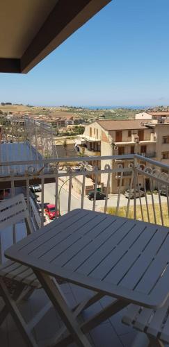 a table on top of a balcony with a view at Vacanze in Sicilia in Siculiana