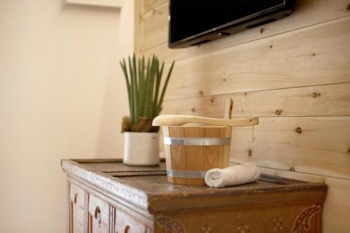 a wooden cabinet with a knife on top of it at Archehof Hochzirm Lodge Franz in Campo Tures