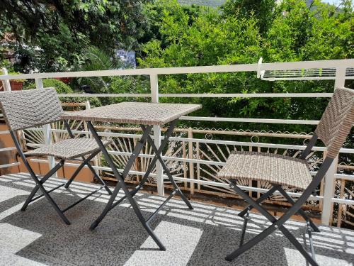 a table and two chairs on a patio at Montenegro Sea Pearl Apartments Petrovac in Petrovac na Moru
