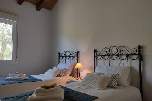 Un pat sau paturi într-o cameră la Casa: Mirador del Valle perdido.