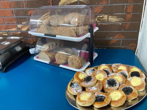 a table with a tray of pastries on a table at Penzion Grasel in Nové Syrovice