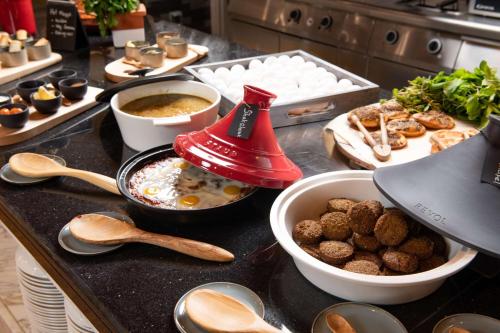 a kitchen counter with a counter top with food on it at Park Inn by Radisson, Riyadh in Riyadh