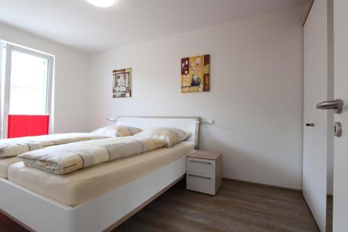 Ένα ή περισσότερα κρεβάτια σε δωμάτιο στο Am Ring 36 Whg 3 Otto