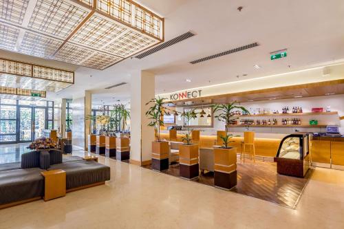 a lobby of a hotel with a bar at Ramada Addis, Addis Ababa in Addis Ababa