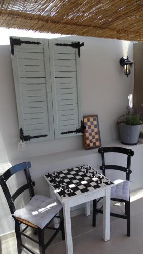 a checkered table and chairs in a room at Malia Boutique Studios in Malia