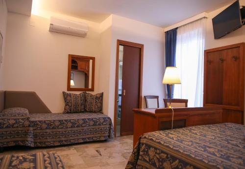 Ένα ή περισσότερα κρεβάτια σε δωμάτιο στο Hotel La Giara