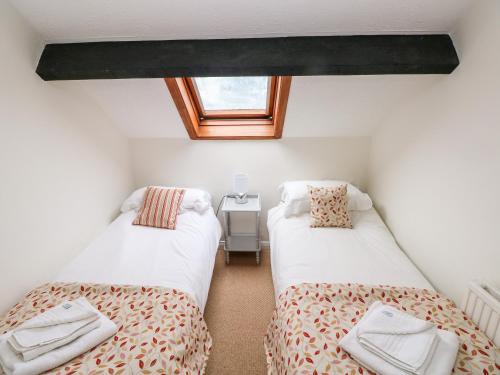 Postel nebo postele na pokoji v ubytování Stable Cottage