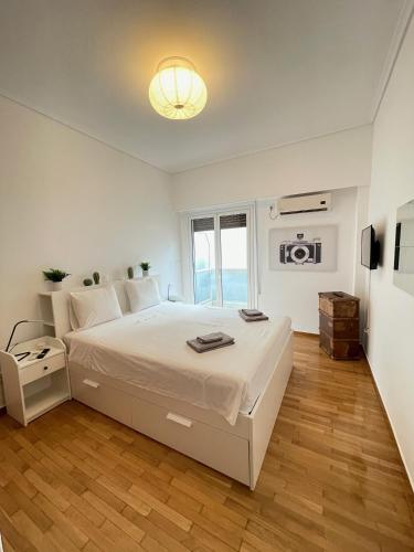 Postel nebo postele na pokoji v ubytování Olympic Hadrian Apartment next to Acropolis