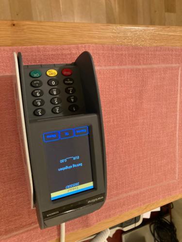 a remote control sitting on top of a table at Frühstückspension Josefinum in Bad Aussee