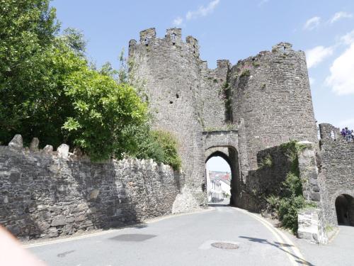 an old castle with an archway in a road at Min Y Don in Colwyn Bay