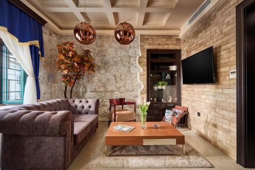 a living room with a couch and a table at Apartment Lav in the City Centre in Kotor