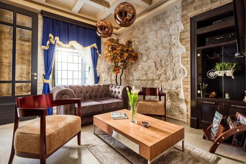a living room with a couch and a table at Apartment Lav in the City Centre in Kotor
