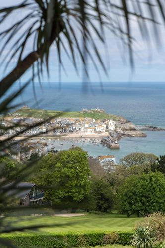 a view of a beach and the ocean at Tregenna Castle Resort in St Ives