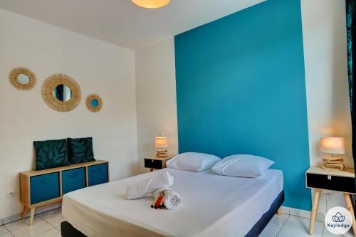 Ein Bett oder Betten in einem Zimmer der Unterkunft T2 - Duplex – Neptune - 34 m2 – Vue mer - Saint-Denis