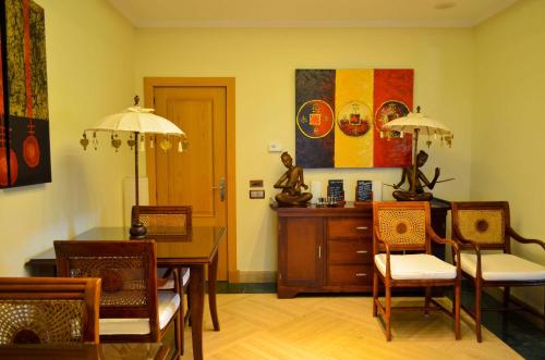 a dining room with a table and chairs at The Marbella Heights Boutique Hotel in Marbella