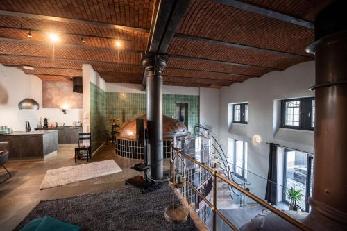 a large room with a large hot tub in the center of the room at Sudhaus/Alte Brauerei in Meisenheim