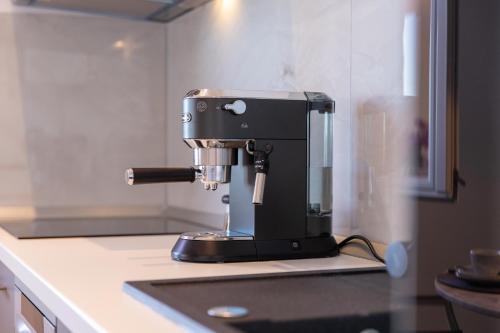 a black coffee maker sitting on top of a counter at Apartment Lea in Stanići