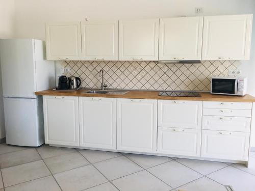 Η κουζίνα ή μικρή κουζίνα στο Beach House Ilaria - Turchese Apt