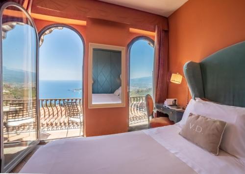 Postel nebo postele na pokoji v ubytování Hotel Villa Ducale
