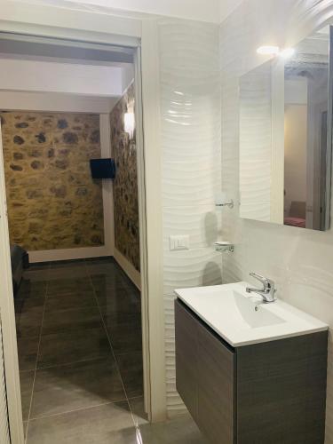 a bathroom with a sink and a shower at Casa castello in Rocca Imperiale