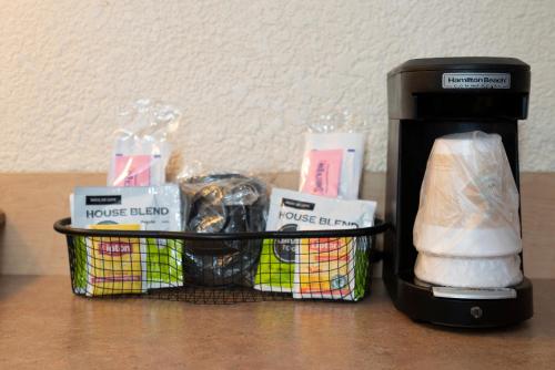 a black coffee maker sitting on top of a table at Red Roof Inn Grand Junction in Grand Junction