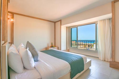 Giường trong phòng chung tại The Boutique Hotel Hurghada Marina