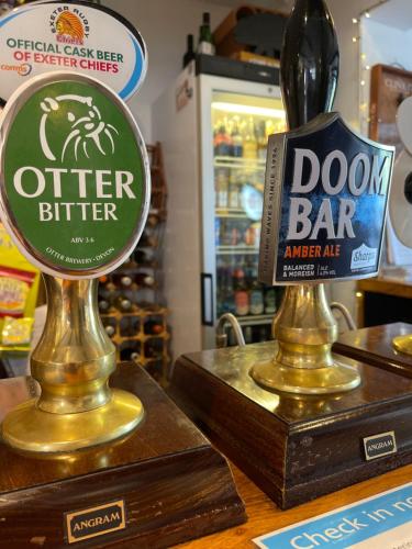 a sign for a door bar on a counter in a store at Red Lion Inn in Sidbury