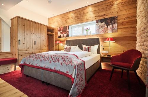 Postel nebo postele na pokoji v ubytování Romantik Hotel Rindenmühle