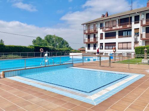 a large swimming pool in front of a building at Apartamento "Kanogal" in Labastida