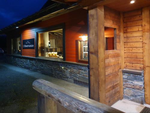 a log building with a window on the side of it at Chalet Hôtel du Bois in Les Houches