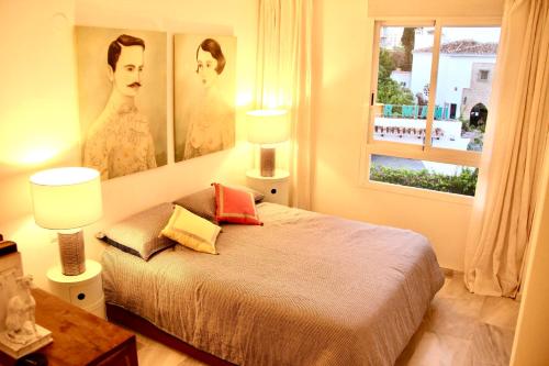 A bed or beds in a room at Inspiring Apartment in Carihuela Beach
