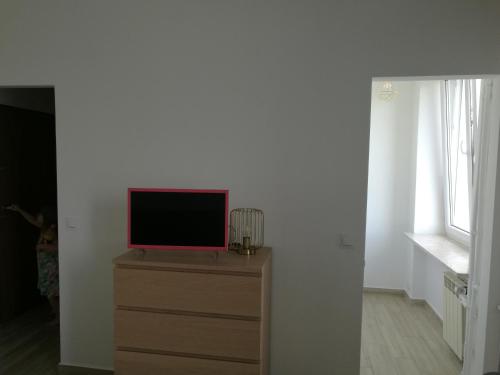 Televízia a/alebo spoločenská miestnosť v ubytovaní Flat Femina Street