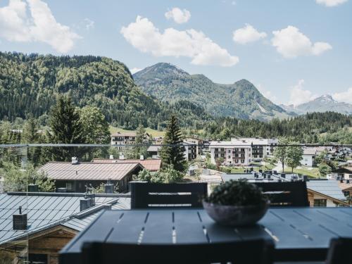 a view of a city with mountains in the background at VAYA Fieberbrunn inklusive Gästekarte in Fieberbrunn