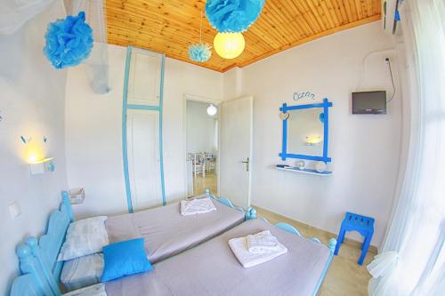 Postel nebo postele na pokoji v ubytování Ninfa Garden Corfù