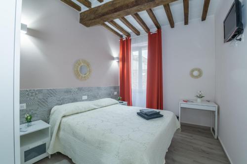 Postel nebo postele na pokoji v ubytování Residenza Borgo Guazzo